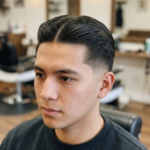 2. Slick Middle Part Mid Taper